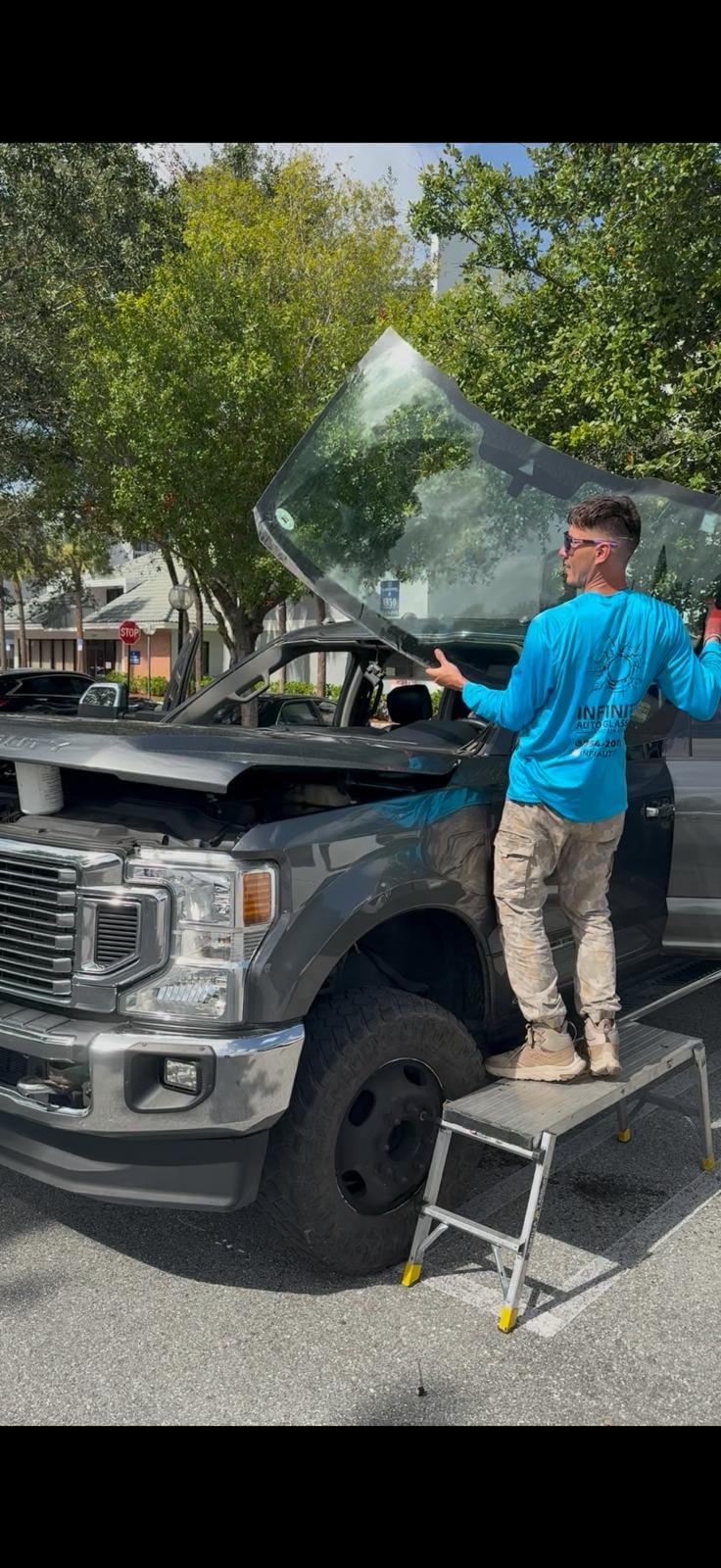 Infinity Auto Glass technician performing mobile windshield service